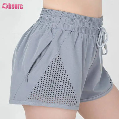 女性用スポーツトレーニングショートパンツ 激光切断 呼吸 ウォーミングアップ ザッパー サイドポケット 固体パターン