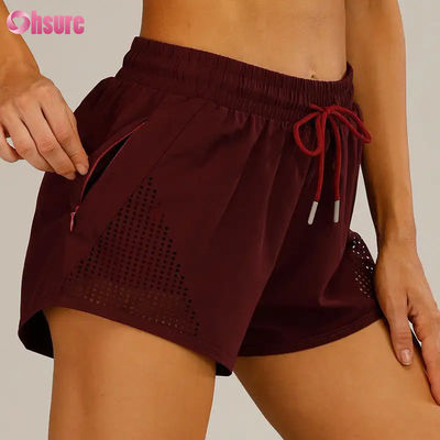 女性用スポーツトレーニングショートパンツ 激光切断 呼吸 ウォーミングアップ ザッパー サイドポケット 固体パターン